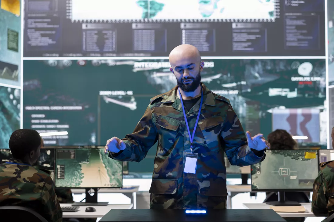 military-personnel-studying-projection-hologram-command-post