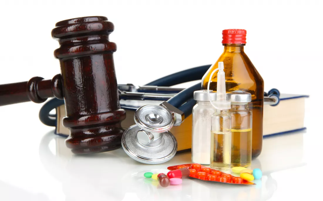 medicine-law-concept-gavel-pills-isolated-white